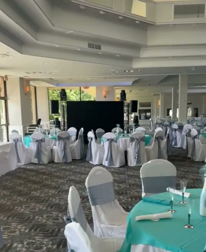 The finished room in full, from the vaulted ceiling down to the tables set for service
